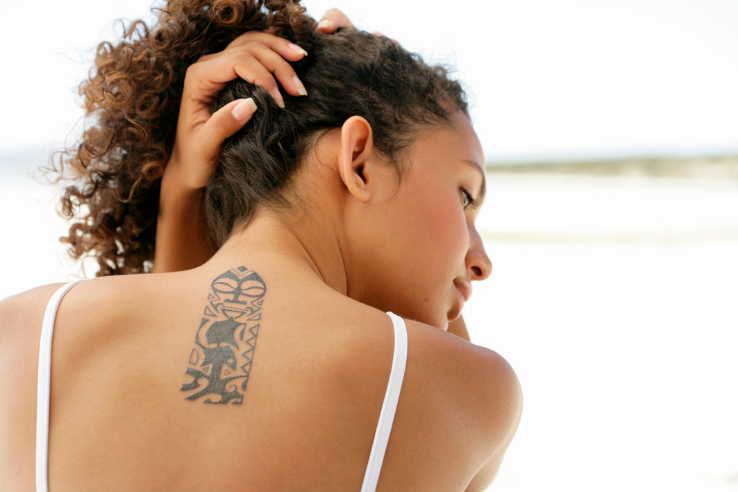Woman's neck with tattoo