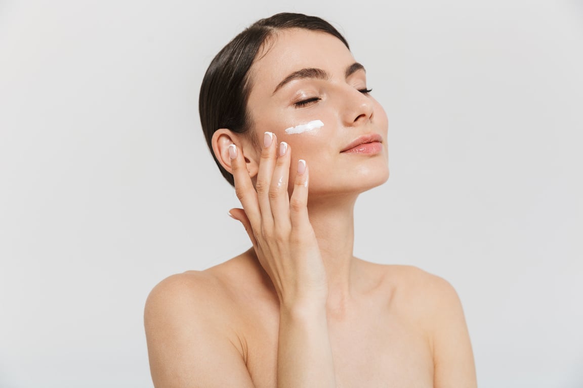 Woman Applying Skincare