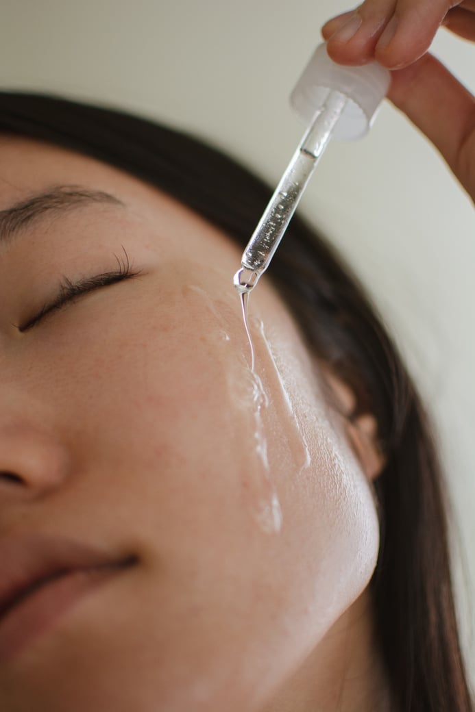 Woman Applying Skincare 